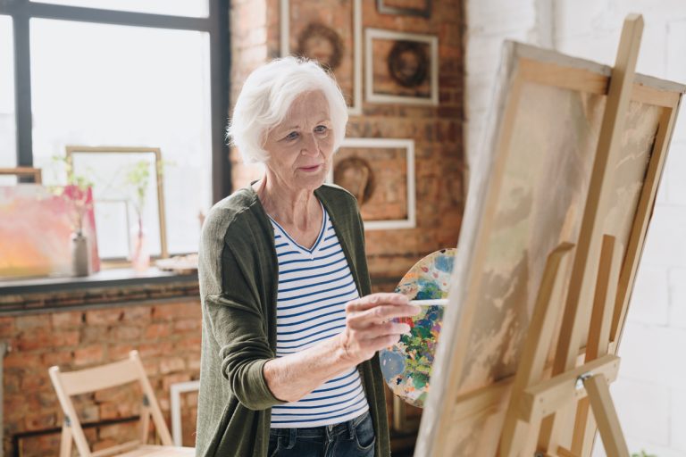 Senior Woman Painting Pictures in Art Studio - Always An Angel Homecare